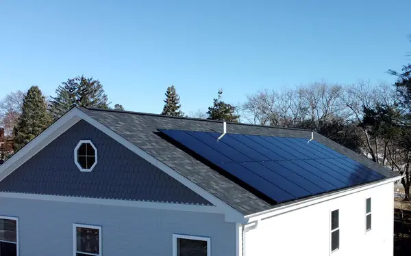 8.4 kW rooftop solar panel installation by SunPol Solar on a home in New Britain, CT, under a clear blue sky